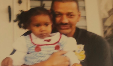 Derrick Fudge with child